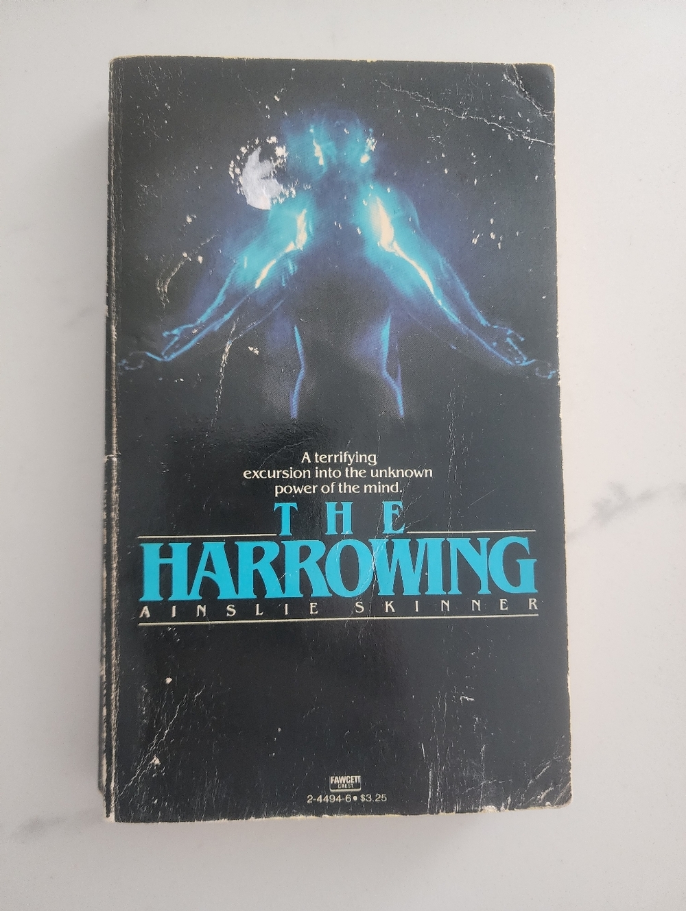 The Harrowing by Ainslie Skinner - Black & Teal Paperback